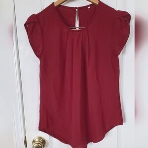 Maroonish blouse sz S front pleats, button neck back, short cap sleeves.